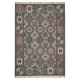 A VESTERVIG rug, handmade with intricate patterns in soft colors. It is rectangular, featuring a flat-woven wool design on a cotton base.