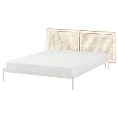 VEVELSTAD bed: white metal frame, rattan headboard, modern design.