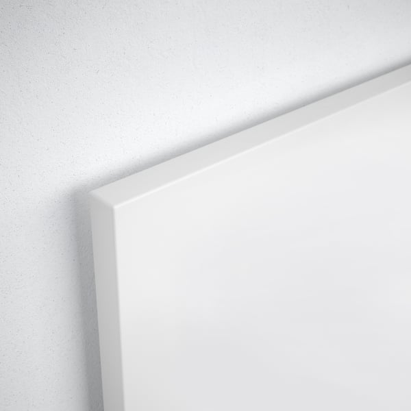 Close-up of clean, white, smooth, and sleek edge of modern furniture.