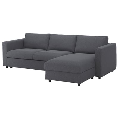 Dark gray l-shaped VIMLE sofa bed. Modern design with plush cushions. Contains storage chaise.