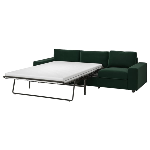 This image shows a dark green VIMLE sofa-bed, modern design, convertible for extra sleeping space, with a thick mattress.