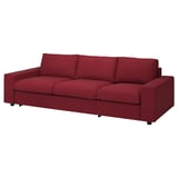 Red vimine sofa with modular design, upholstered in fabric and supported by wooden legs.