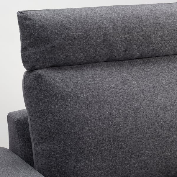 Sofa close-up: plush, dark grey cushions show quality fabric & sturdy design.