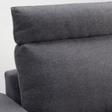 Sofa close-up: plush, dark grey cushions show quality fabric & sturdy design.