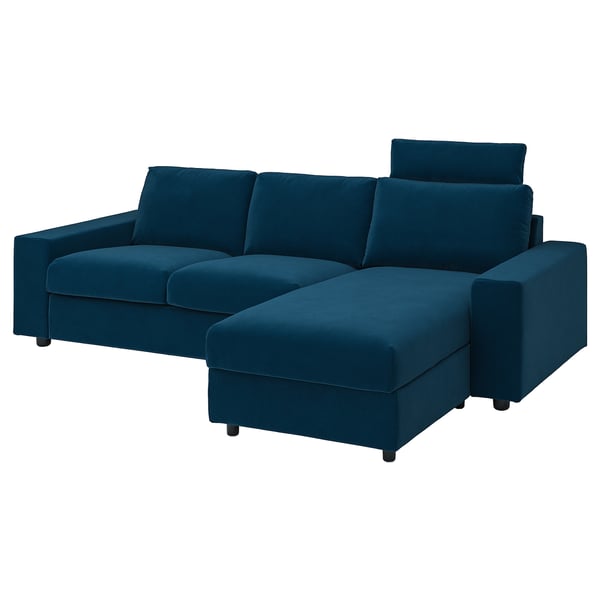 Blue l-shaped sofa with storage, velvet fabric, deep seat, and headrests.