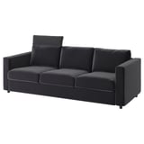 A modern VIMLE sofa in dark gray. It a sleek design, three cushions, and a headrest for comfort.