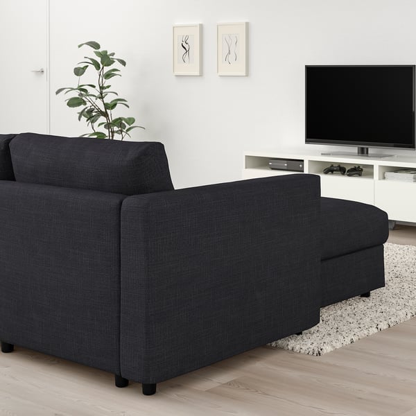 Modern living room with VIMLE dark grey sectional sofa, minimalist style.