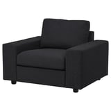 Black VIMLE armchair, modern and sleek design, cozy for seating.