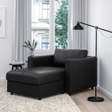 Modern living room: black VIMLE sofa. Compact, comfortable, with storage & large window.