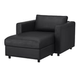 Modern black l-shaped sectional sofa with storage and sleek design.