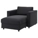 A dark gray VIMLE sectional sofa with a chaise lounge. Its designed for comfort and has a sleek, modern look.