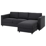 A VIMLE dark grey sectional sofa. It is modern, rectangular, with a comfortable and sleek design. The sofa a chaise longue, suitable for relaxing.