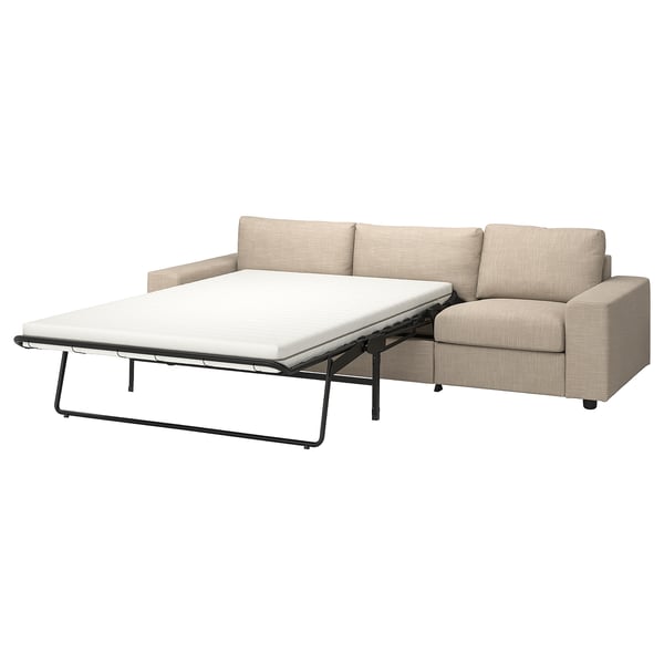 Beige VIMLE sofa-bed, modern design, multi-fabric upholstery, partially opened with flat mattress.