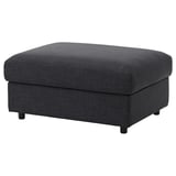 VIMLE gray fabric footstool, rectangular, elevated on black legs, soft to touch.