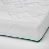 Clean, white mattress pad with green trim, neatly folded, showing quality fabric and stitching.