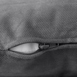 Close-up of zipper on gray fabric, showcasing smooth, high-quality material.