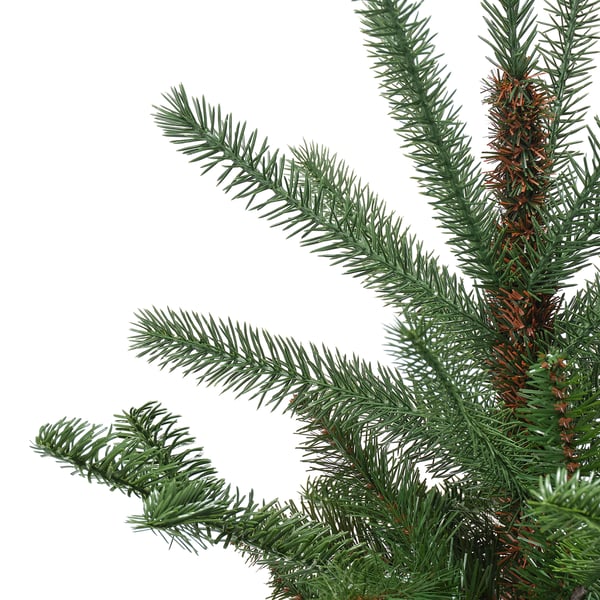Close-up of realistic artificial pine needles, vivid green, detailed, and lifelike.