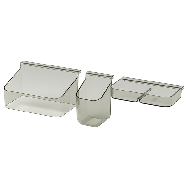 Three VISSLAÅN plastic organizers by IKEA for drawer storage.