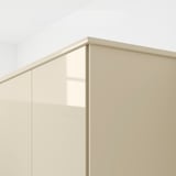 Modern beige gloss cabinet side panel with integrated handle, designed for easy cleaning and installation.