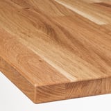 Polished wood surface, smooth texture, natural grain pattern.