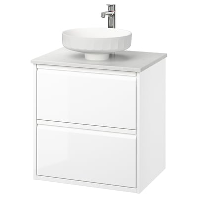 Modern white bathroom vanity, wall-mounted with sleek, minimal design, round marble sink, chrome tap.
