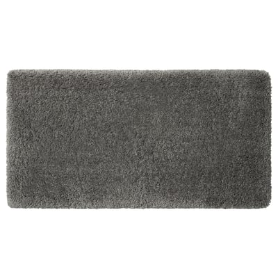 Grey rectangular bath mat with soft texture, recycled polyester pile, latex backing.