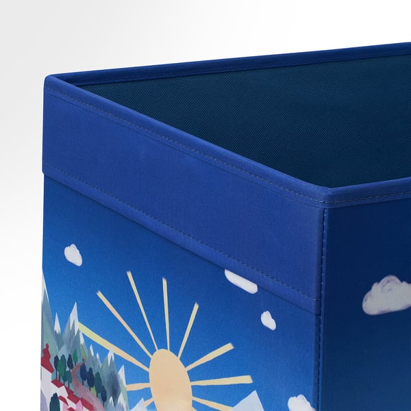 A sturdy blue fabric storage box with a vibrant mountain and sun design, ideal for kallax shelving, showcasing quality craftsmanship.