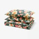 Floral patterned bedding set, dark blue, rectangular shape, with pink, yellow, and green flowers. Made of cotton and lyocell.