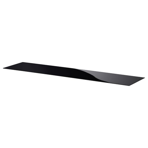 A black glass shelf from IKEAs BESTÅ series. Its flat and rectangular, perfect for storage or decoration.