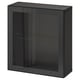 A black IKEA BESTÅ storage unit with a glass door and glossy finish. Its rectangular, featuring a glass shelf inside and a sleek, modern design.