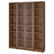 Large BILLY bookcase in brown. Glass doors and multiple shelves.