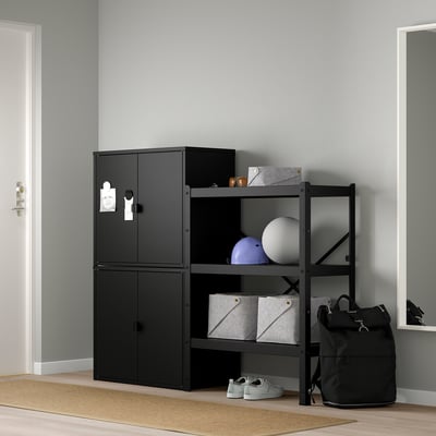 Black BROR storage system, featuring cabinet & open shelves. Holds various items, taller than a backpack, fits near a door.