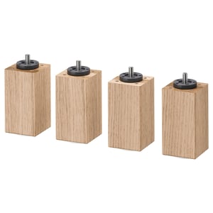 Four wooden furniture legs with black round tops, made of solid oak with clear acrylic lacquer finish.