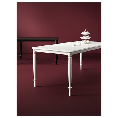 DANDERYD white dining table, sleek rectangular design with four sturdy steel legs.
