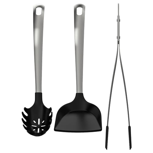 Three black kitchen utensils: slotted spoon, solid spoon, and skimmer; silver stainless steel handles.