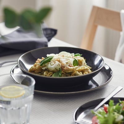 GLADELIG deep dark-grey plate, round, stoneware with reactive glaze, handcrafted look.