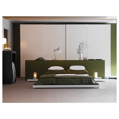 A GRÖNÖ table lamp. It is white, rectangular, and crafted from amino resin paint and frosted glass, producing soft mood lighting.