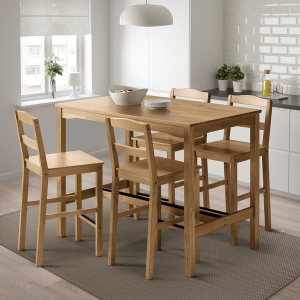 Brown wooden dining set with 4 ladder-back chairs, compact for small spaces.