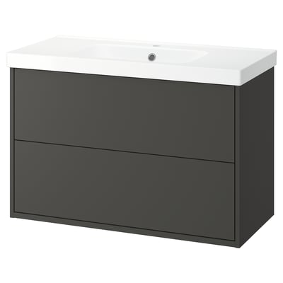 A modern grey bathroom cabinet with a white sink on top. It has two large drawers for storage.
