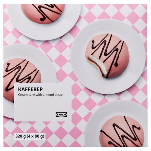 IKEAs KAFFEREP cream cakes with almond paste on pink plates. One has a bite taken.