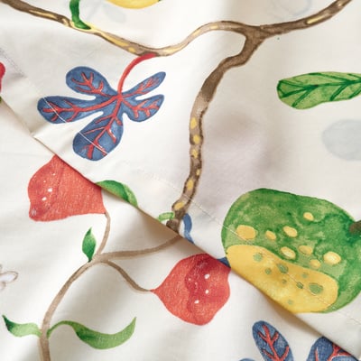 Vibrant floral flat sheet folded, showcasing crisp, smooth texture and vivid colours