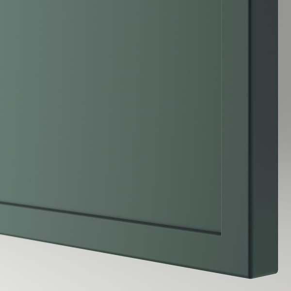 Close-up of smooth, grey-green matte finish cabinet door, showing sleek design and quality texture.