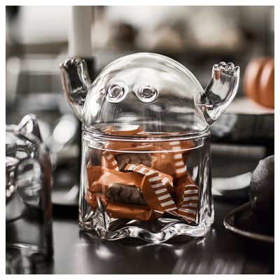 Ghost candy jar holds chocolate, keeps fresh, adds festive touch. Or ghost candy jar with lid holds chocolates for halloween.
