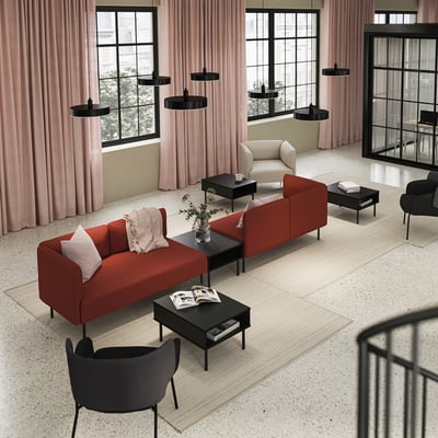 Modern living room with red & beige LILLEHEM sofas, black coffee tables, pink curtains, and black pendant lights.