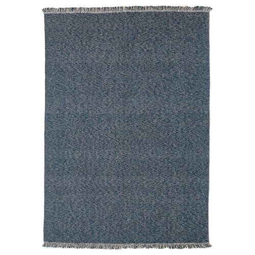Dark blue rectangular cotton rug with herringbone pattern and fringe.