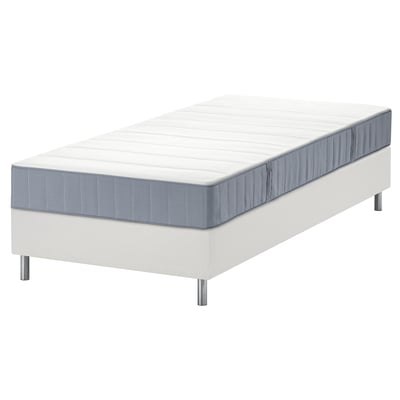 White LYNGÖR bed with grey vesteröy mattress, pocket springs, raised on metal legs.