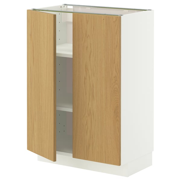 A METOD kitchen unit with white base and light wood doors. It has two adjustable shelves inside and is designed for kitchen storage.