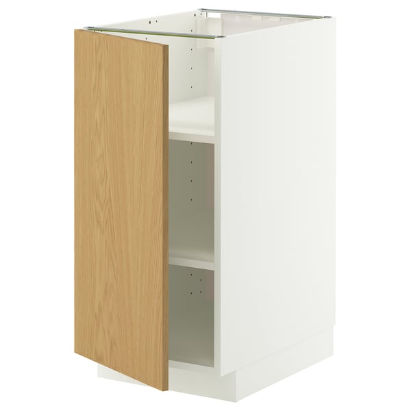 A white METOD cabinet with a light oak door, featuring adjustable shelves.