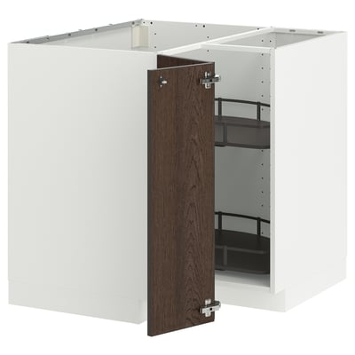 White kitchen cabinet with dark brown door, shelves, and metallic hinges.