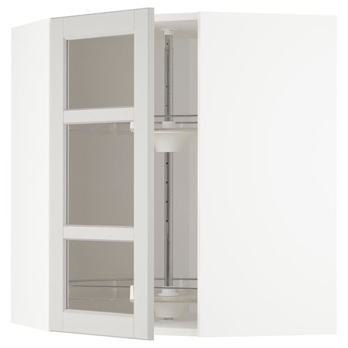 White METOD corner kitchen cabinet with glass doors and steel shelves.